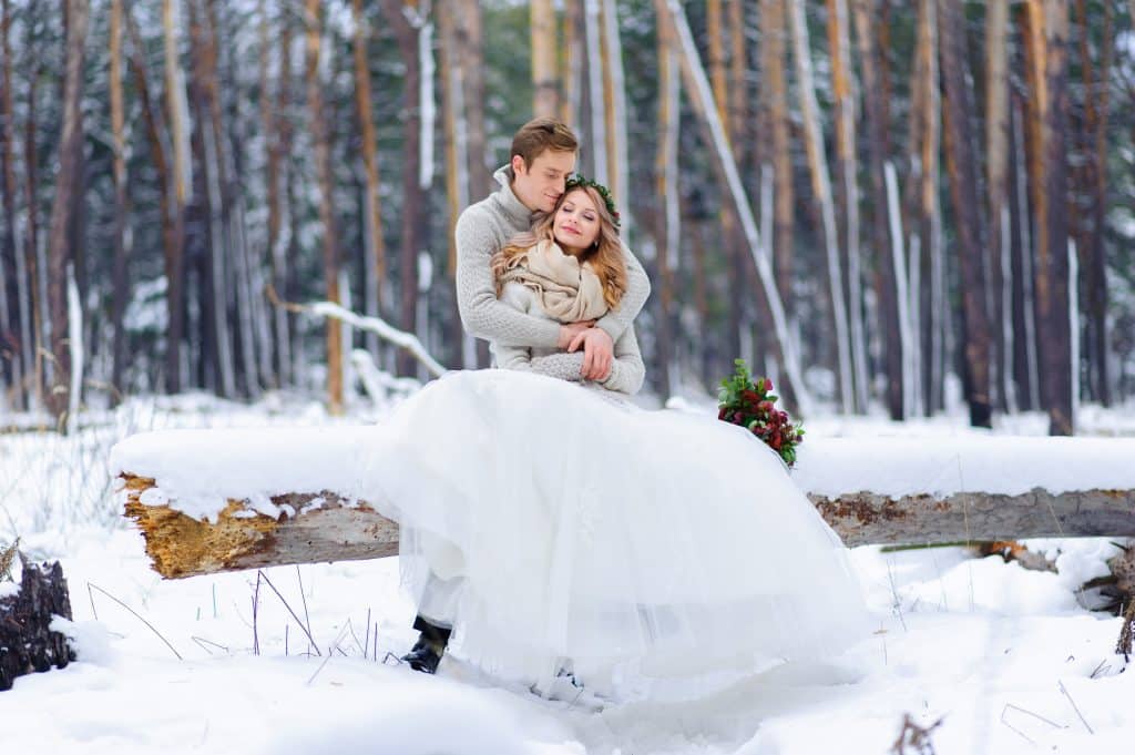 Beautiful wedding couple on their winter wedding