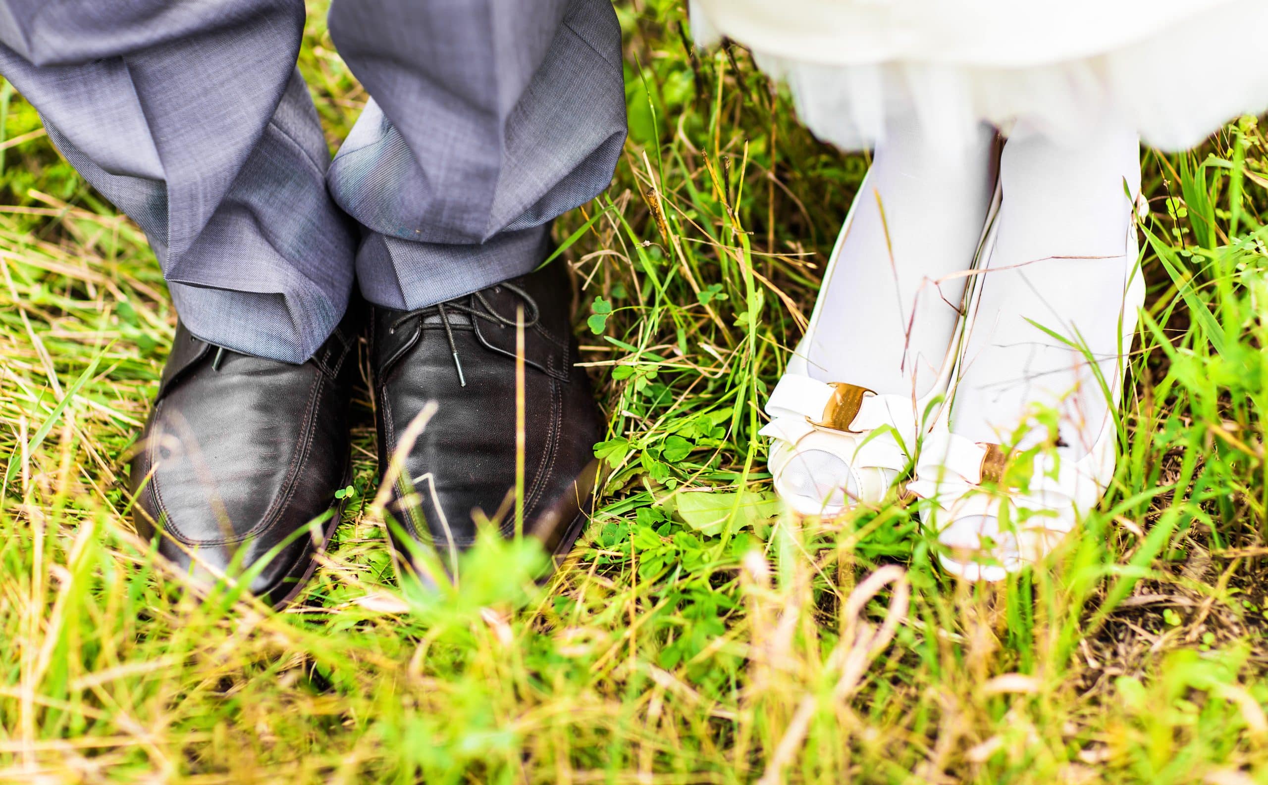 feet and shoes of newlyweds couple. Wedding couple, bride and groom