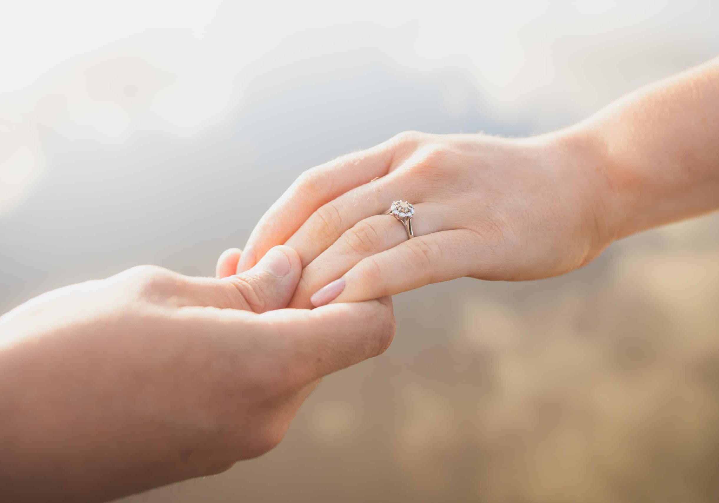 engagement-ring-holding-hands-2021-09-03-16-20-01-utc