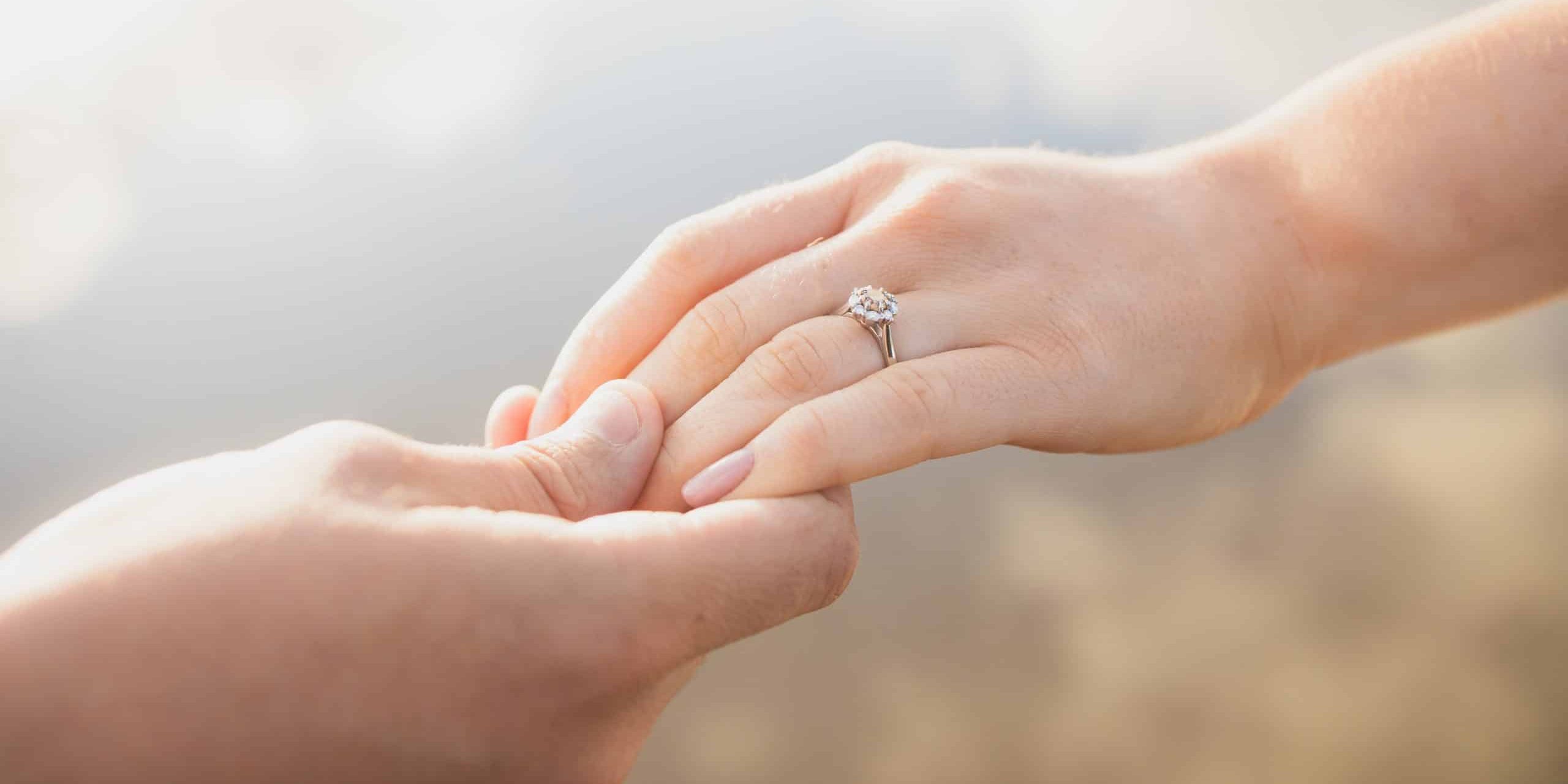 engagement-ring-holding-hands-2021-09-03-16-20-01-utc