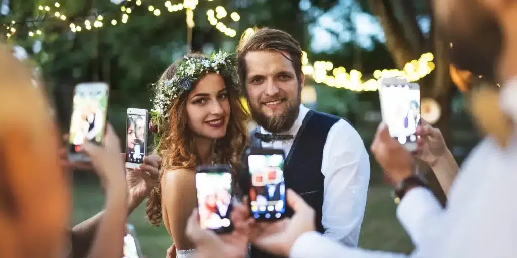 guests-with-smartphones-taking-photo-of-bride-and-2022-02-02-03-47-53-utc-1024x683