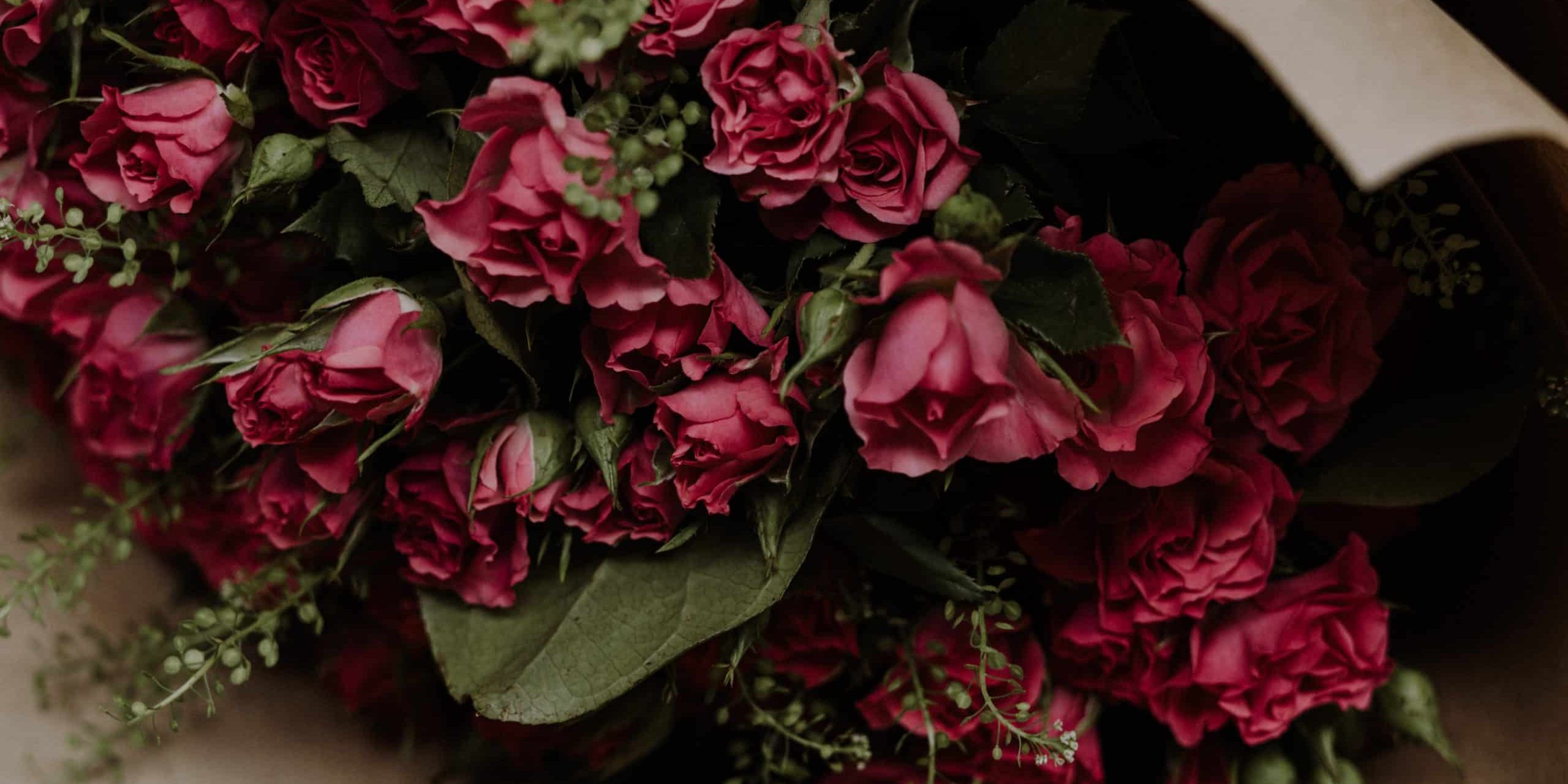 moody-shot-of-pink-flowers-bouquet-with-greens-2023-11-27-05-02-03-utc