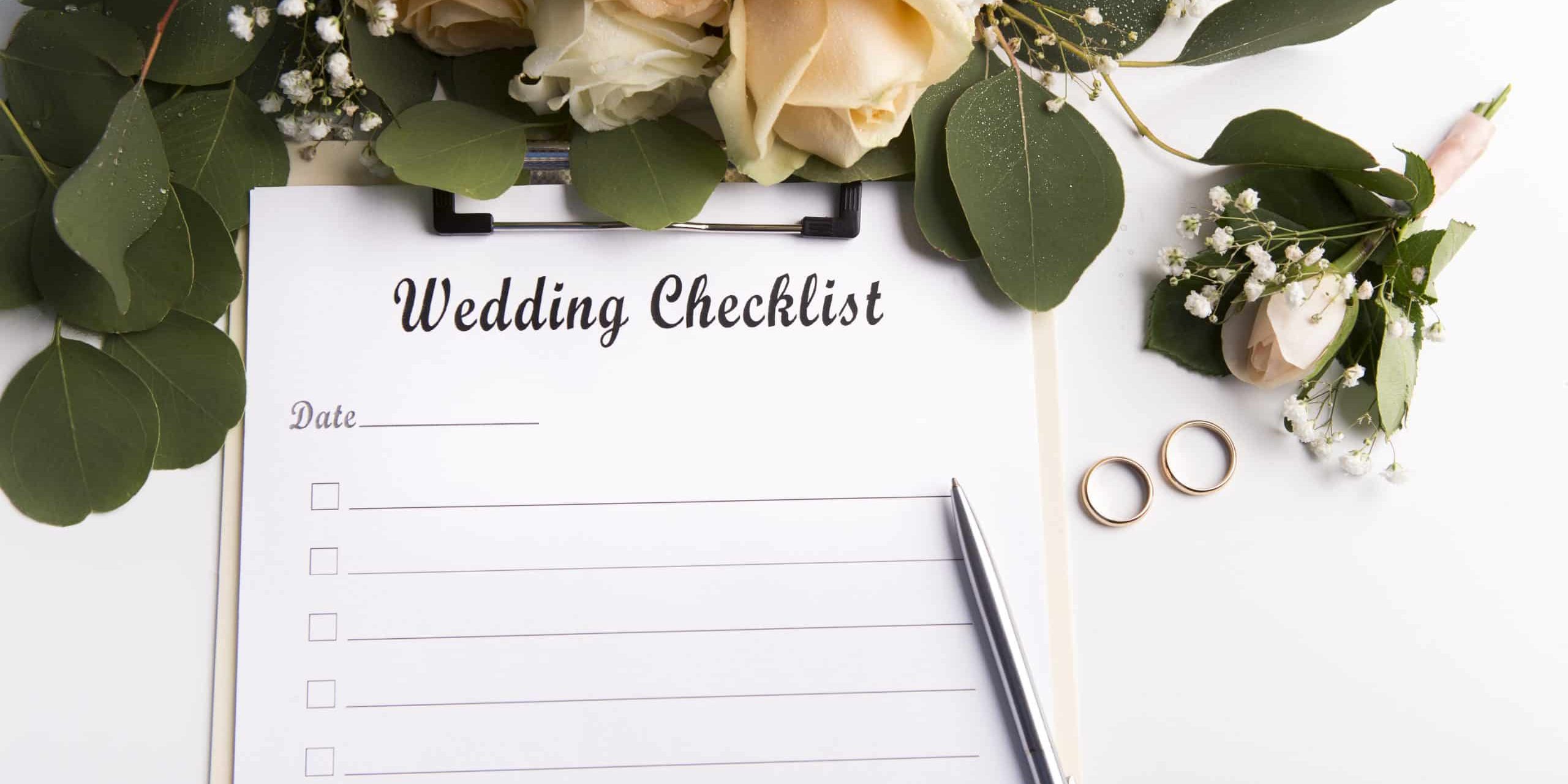 Wedding checklist with copy space for text and roses on background